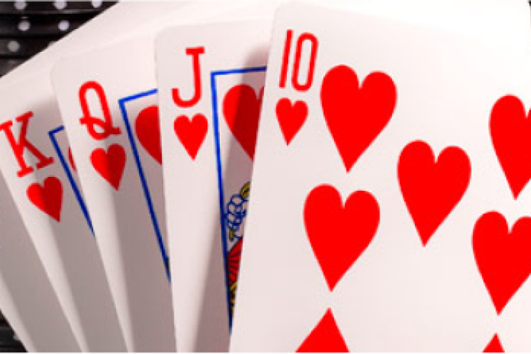 A spread of poker cards showing a royal flush with all hearts