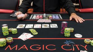 Close up of a Poker Table with the words "Magic City Poker Room"